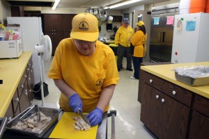 Disaster Relief volunteer Betty Stone prepares meals to be delivered to victims of recent flooding in Illinois.