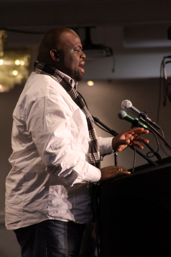 East St. Louis church planter Barnicio Cureton prays during the opening session of the Annual Meeting.