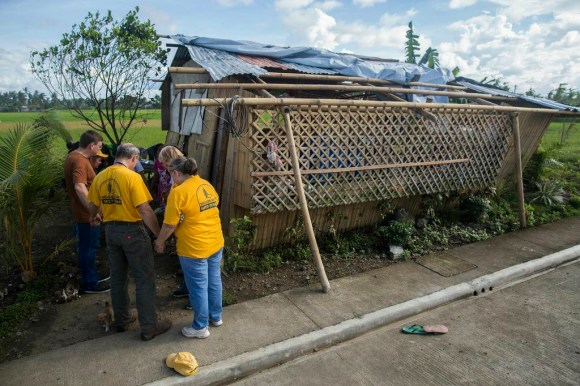 Disaster relief volunteers from the Southern Baptists of Texas Convention visited families whose homes and livelihoods were disrupted by Typhoon Haiyan. The volunteers listened to the families’ heartbreaking stories and prayed with them, then distributed badly needed food and building supplies.  BGR photo, via BP 