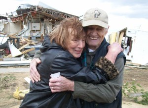 Raymond and Betty Kramer hug each other after being interviewed by the media about their experience in a Rochelle, IL restaurant's storm cellar while a tornado was on the ground above them. This photo was taken during and interview  in the town of Fairdale, IL, which was completely destroyed by tornado April 9.
