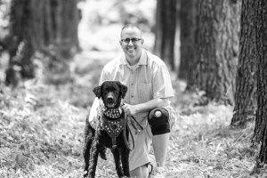 Pastor Aaron Jackson’s dog, Archer, has helped him overcome symptoms of PTSD and also is the official greeter at his church, Emmanuel Baptist in Sterling. Photo courtesy of Aaron Jackson