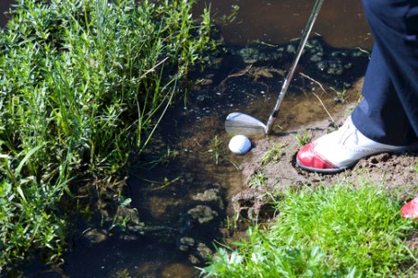 Difficult golf ball in the mud